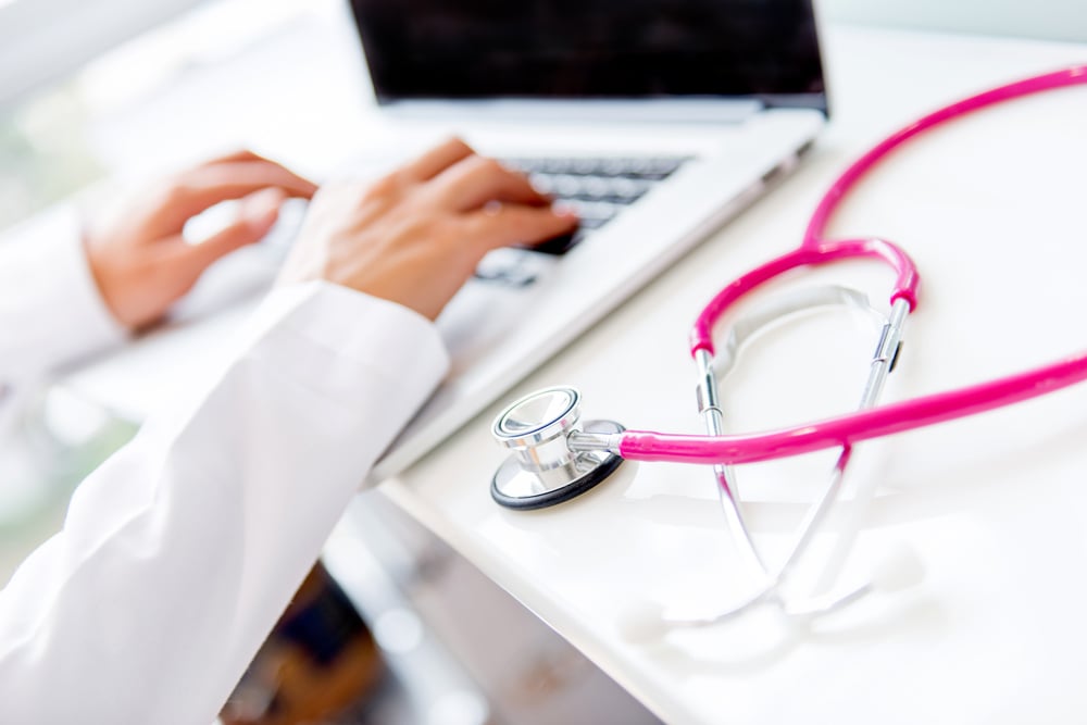 Doctor working on a laptop at the office