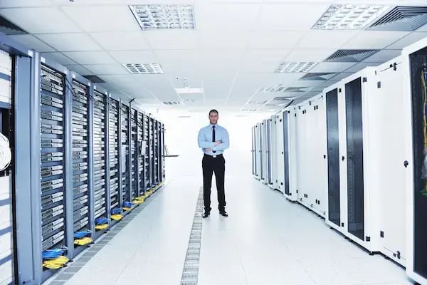 young handsome business man engineer in datacenter server room